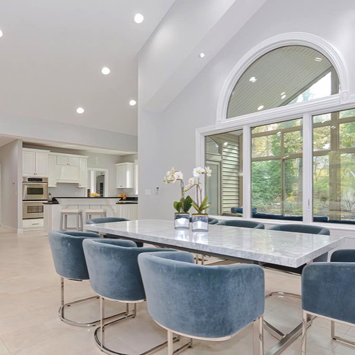 contemporary catherdral kitchen with palladium windows recessed lighting and white cabinets